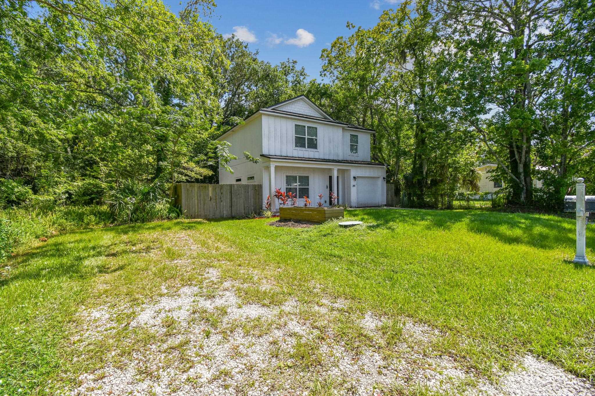 241 Columbus Street St. Augustine, FL 32084 - Photo 2 of 47 a house view with a garden space