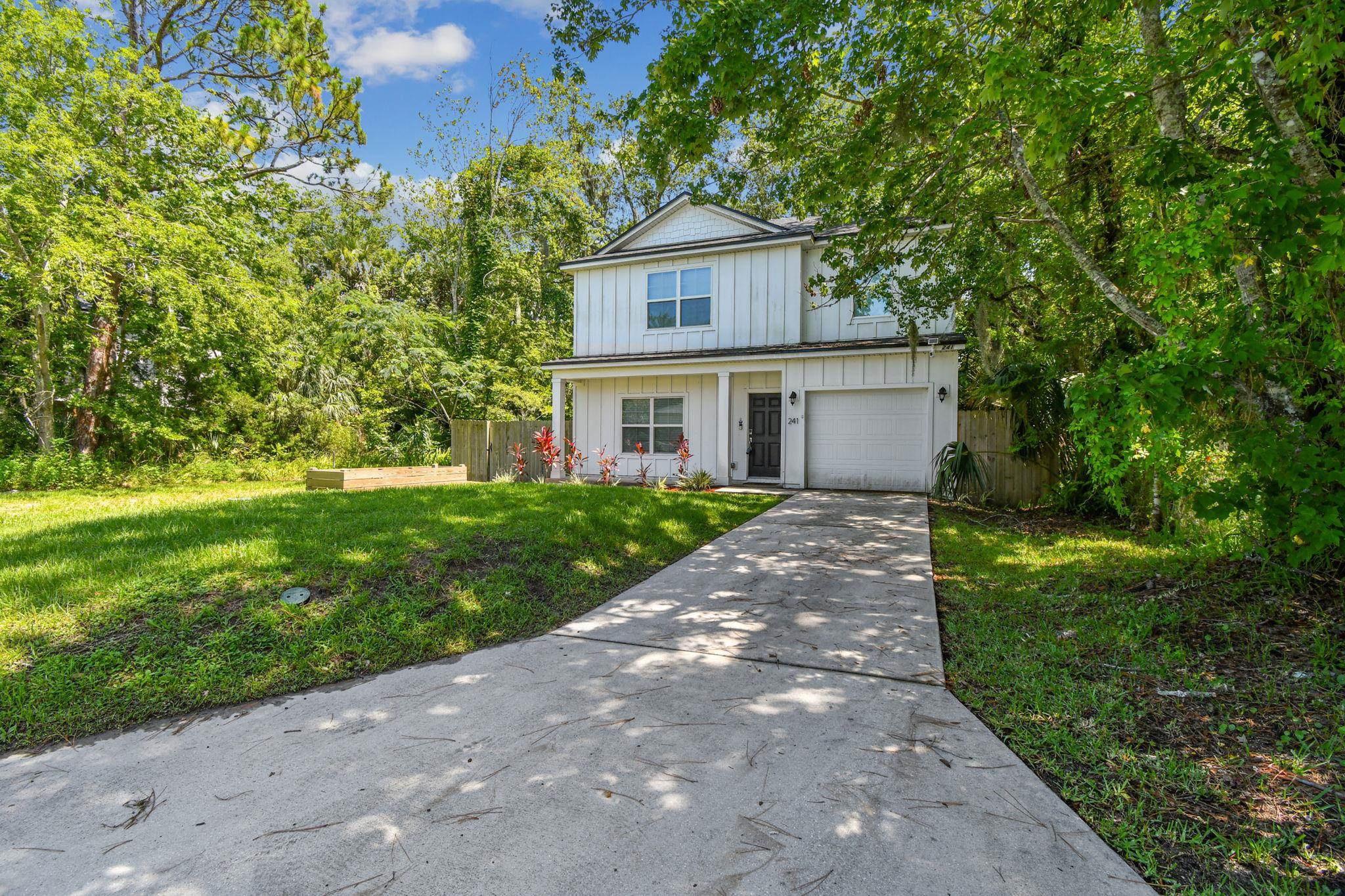 241 Columbus Street St. Augustine, FL 32084 - Photo 3 of 47 a front view of a house with a yard