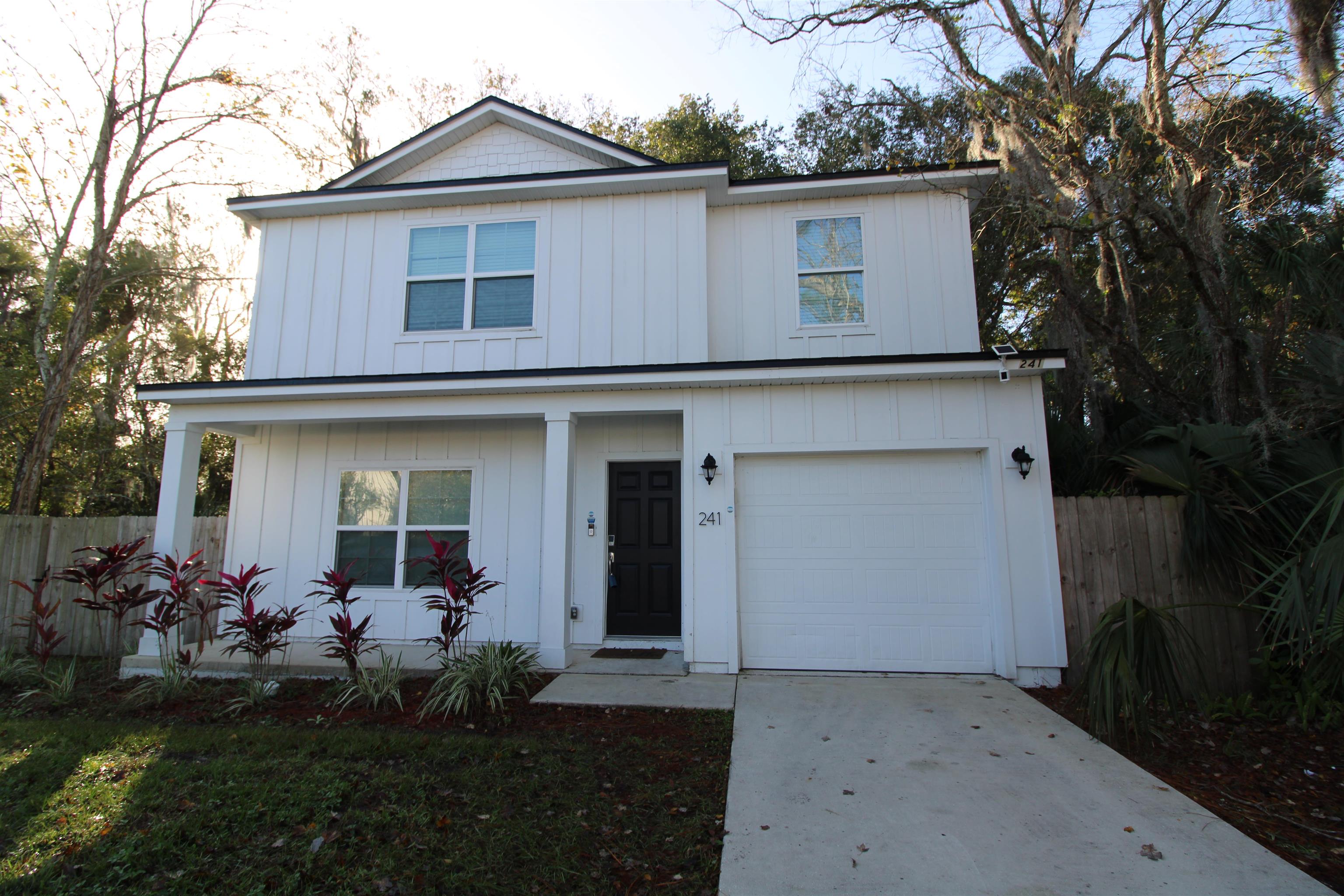 241 Columbus Street St. Augustine, FL 32084 - Photo 45 of 47 a front view of a house with a garden