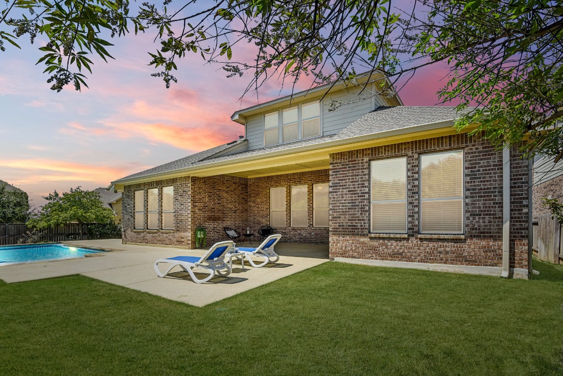 a front view of house with yard and outdoor seating