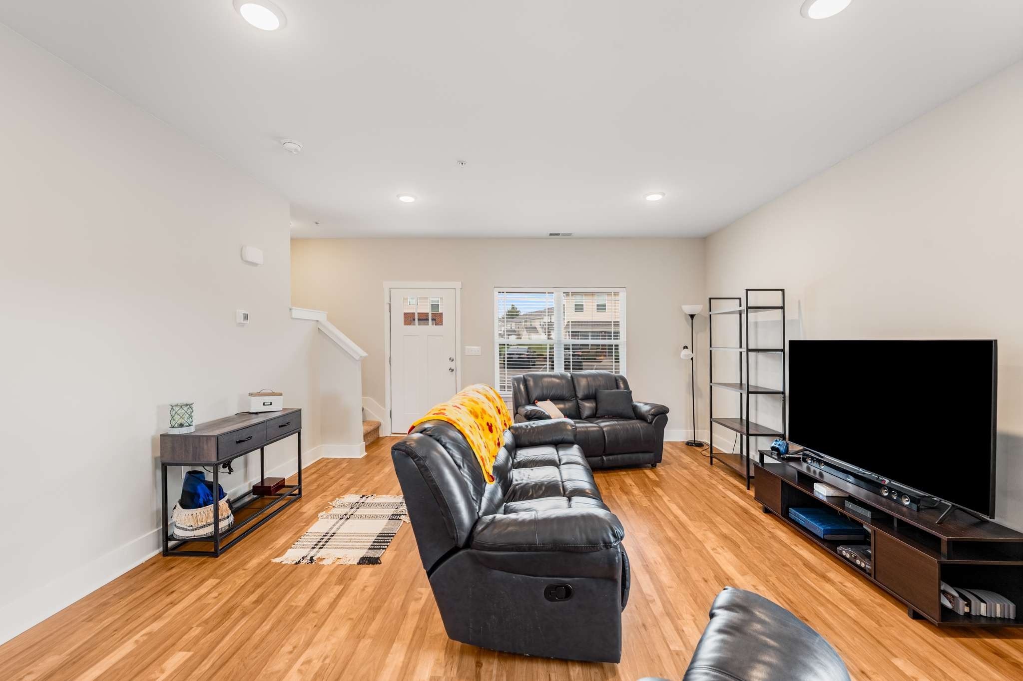 7024 Magnolia Crossings Spring Hill, TN 37174 - Photo 15 of 40 a living room with furniture and a flat screen tv