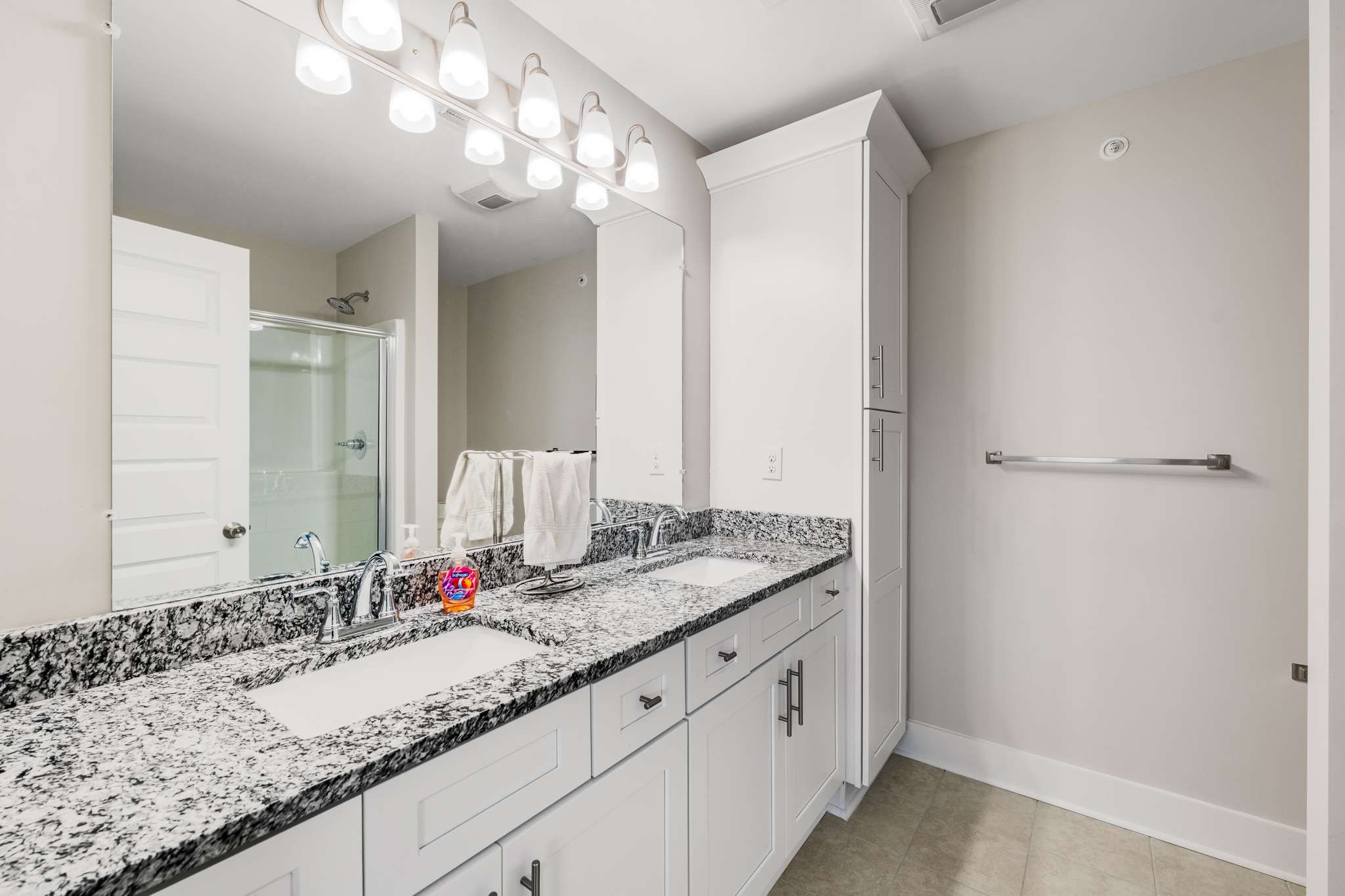 7024 Magnolia Crossings Spring Hill, TN 37174 - Photo 18 of 40 a bathroom with a granite countertop sink and a mirror