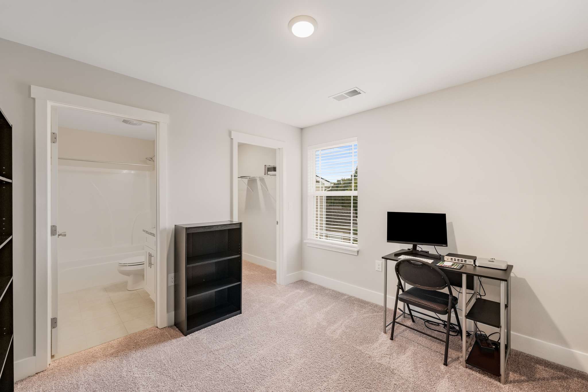 7024 Magnolia Crossings Spring Hill, TN 37174 - Photo 21 of 40 a view of room with flat screen tv and windows