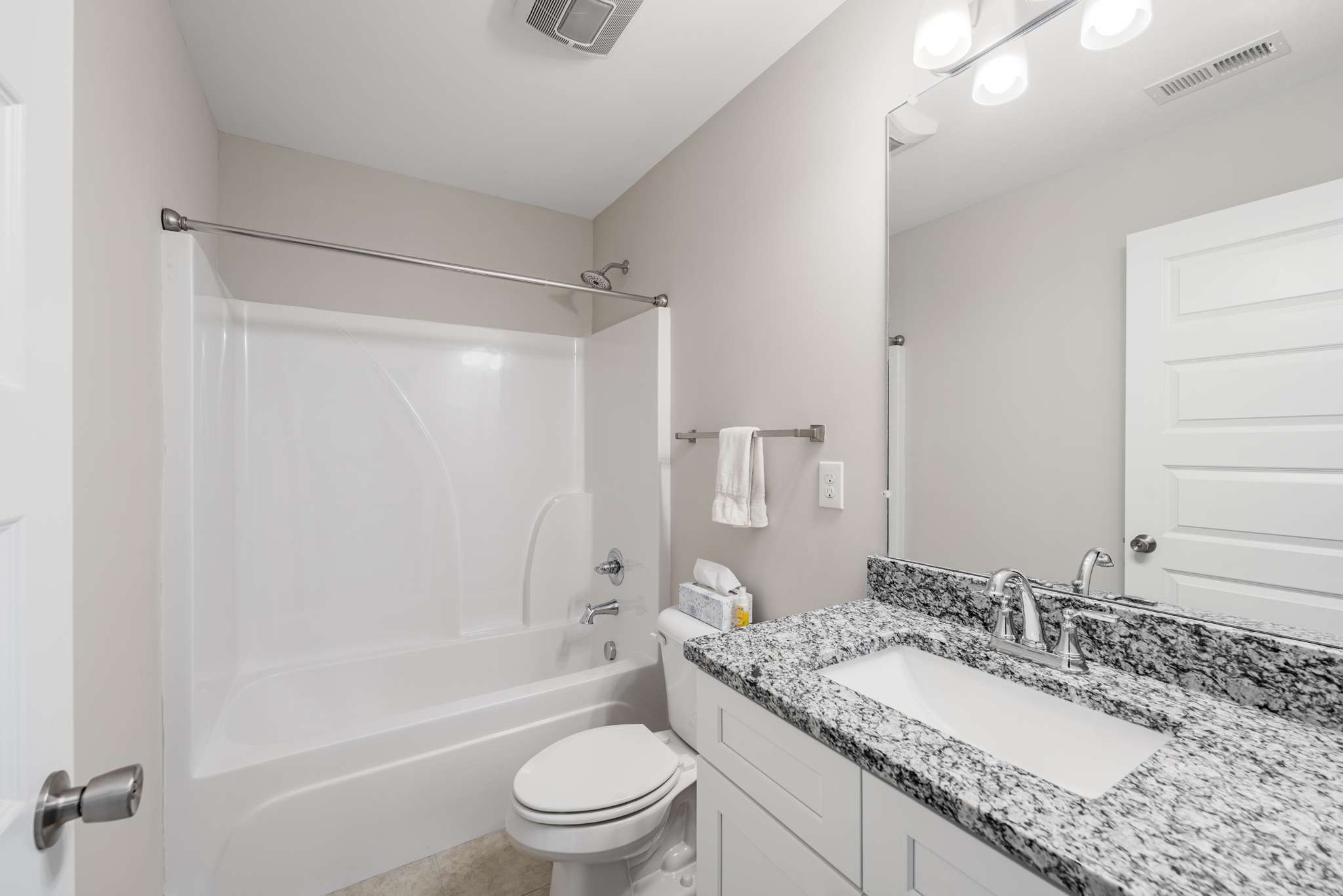 7024 Magnolia Crossings Spring Hill, TN 37174 - Photo 22 of 40 a bathroom with a granite countertop sink toilet mirror and shower