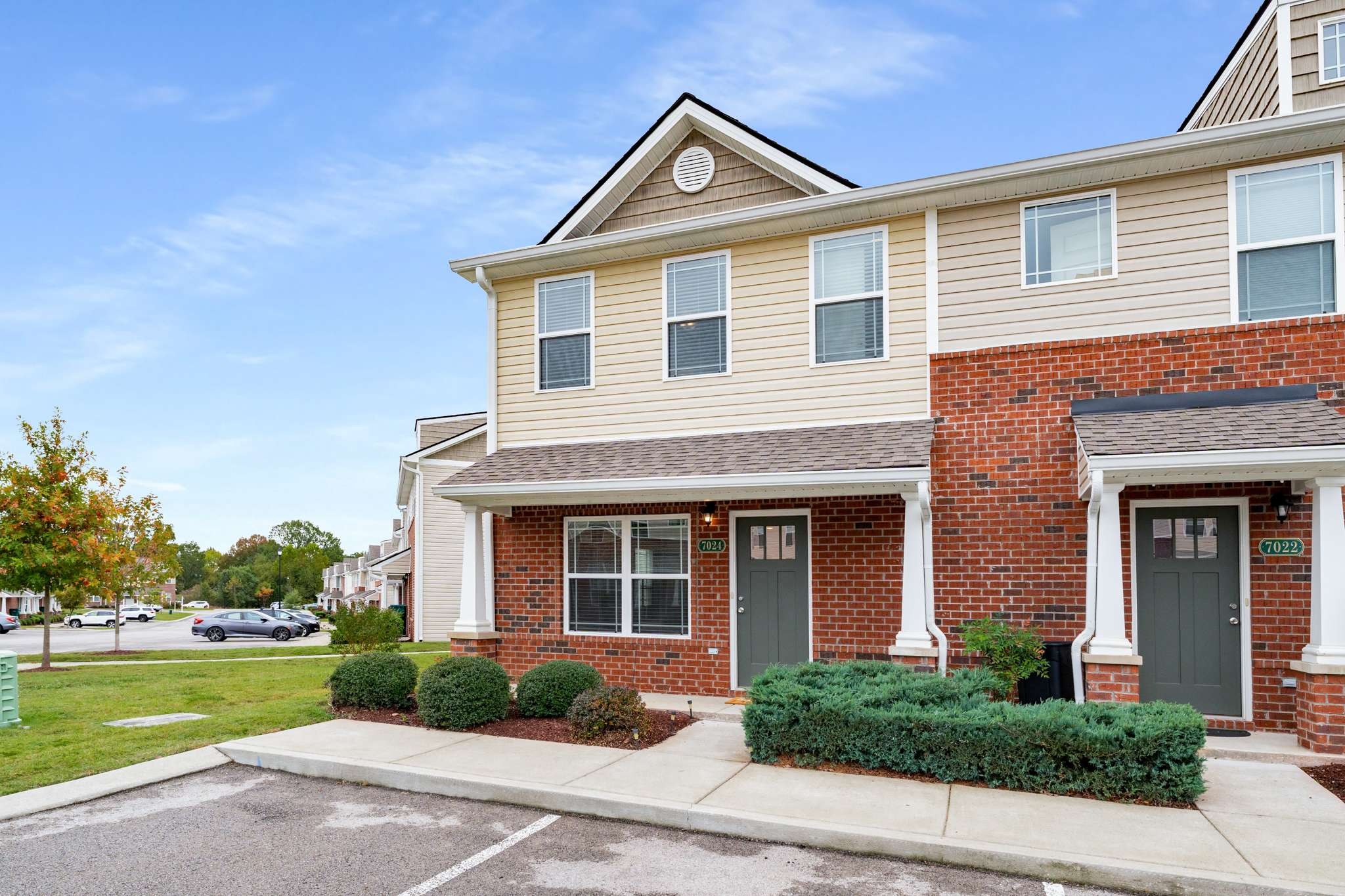 7024 Magnolia Crossings Spring Hill, TN 37174 - Photo 3 of 40 a front view of a house with a yard and garage