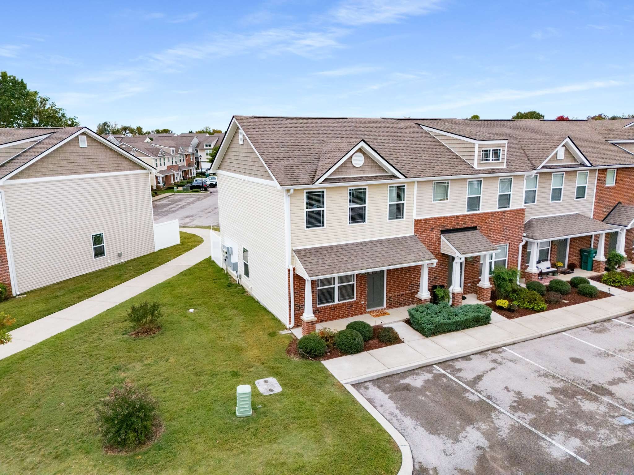 7024 Magnolia Crossings Spring Hill, TN 37174 - Photo 32 of 40 a aerial view of a brick house next to a yard