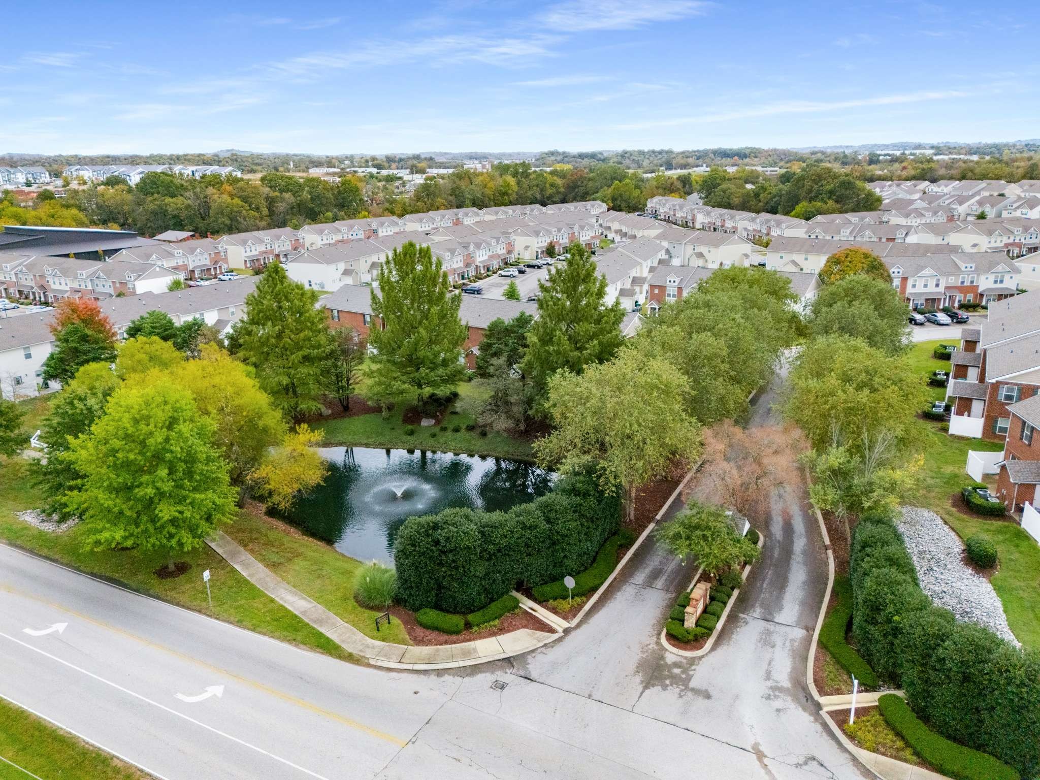 7024 Magnolia Crossings Spring Hill, TN 37174 - Photo 40 of 40 an aerial view of a city with lots of residential buildings ocean and mountain view in back