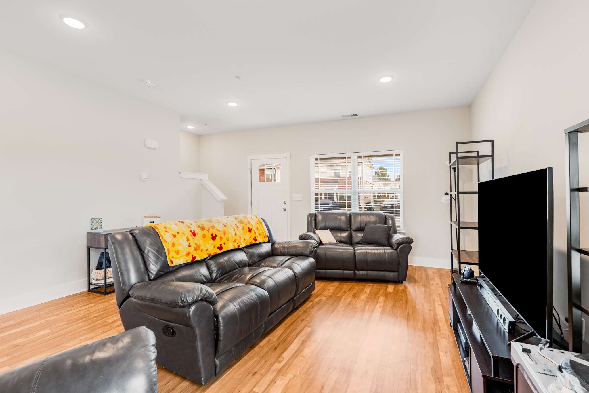 7024 Magnolia Crossings Spring Hill, TN 37174 - Photo 7 of 40 a living room with furniture and a flat screen tv