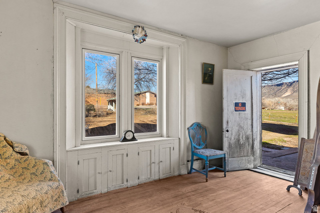 83 West 100 South Virgin, UT 84779 - Photo 8 of 35 Entryway with hardwood / wood-style floors, a mountain view, and plenty of natural light