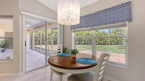 a kitchen with white cabinets stainless steel appliances and sink