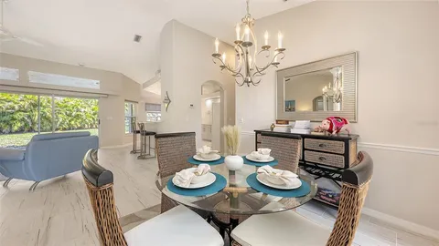 a bedroom with a large bed couch and a window