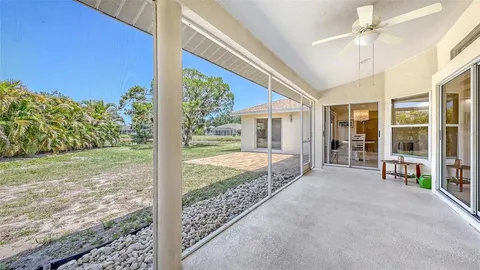 a bathroom with a granite countertop sink mirror and bathtub