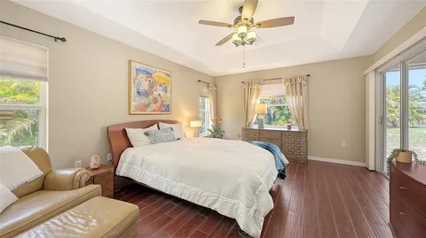 a spacious bathroom with a double vanity sink mirror and bathtub