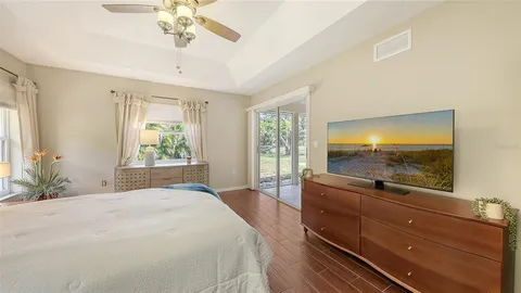 a living room with furniture a table chairs and a window