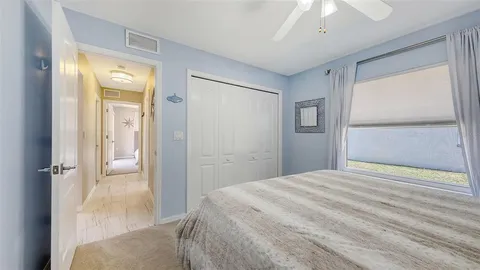 en empty room with large windows