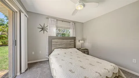 an aerial view of a house with a yard and garden