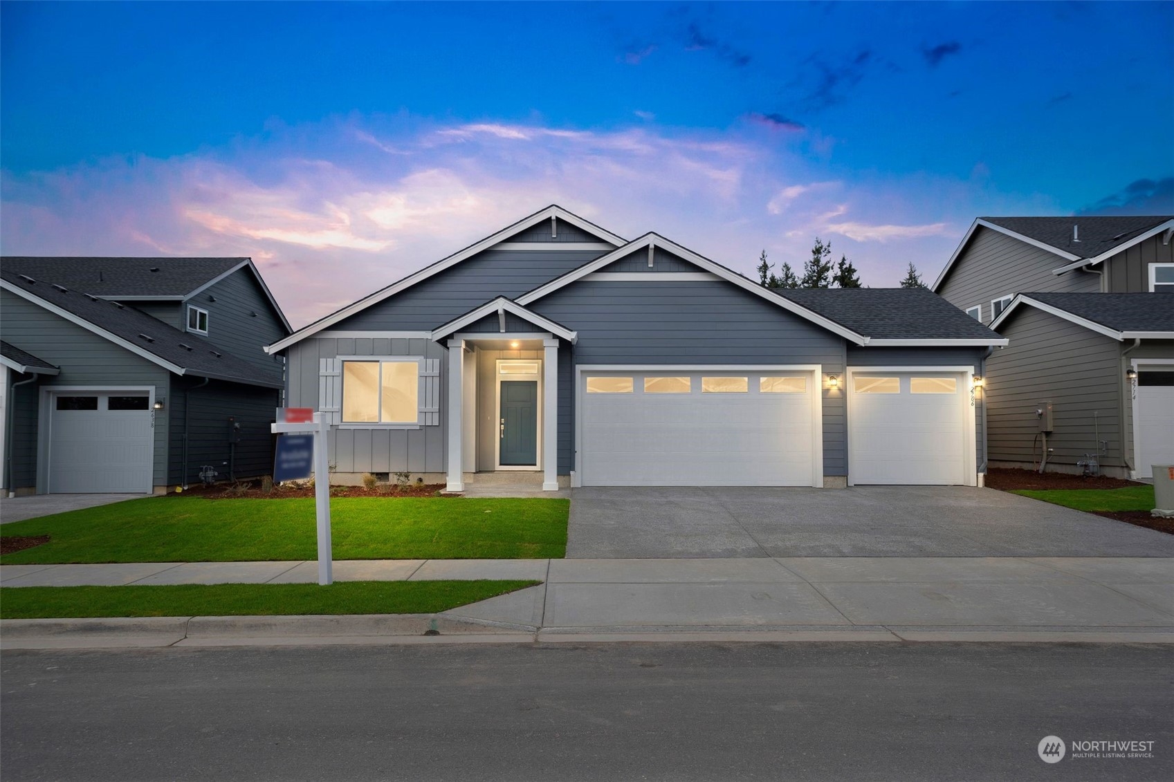 2722 South 7th Circle Ridgefield, WA 98642 - Photo 1 of 32 a front view of a house with a yard and garage