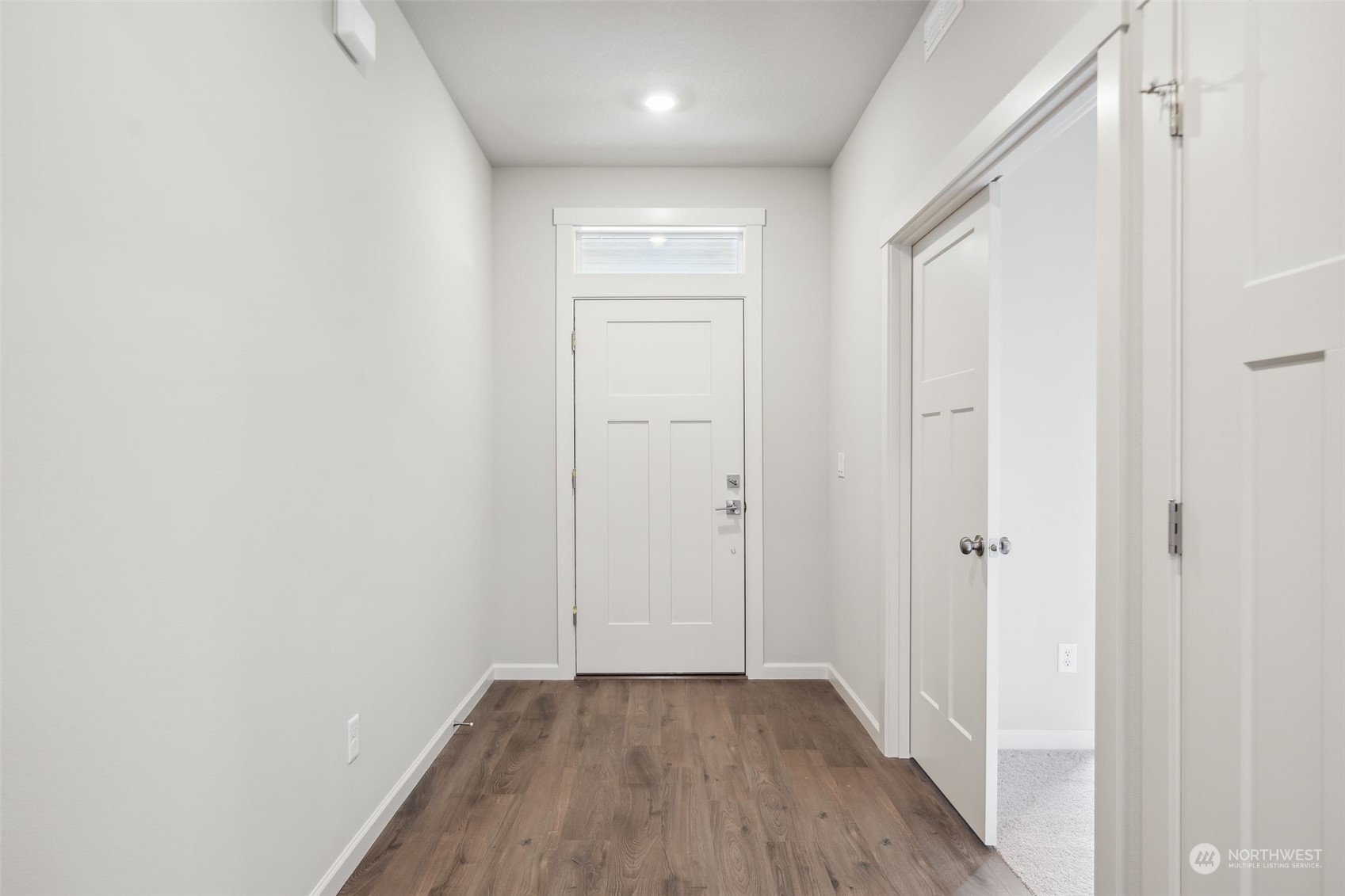 2722 South 7th Circle Ridgefield, WA 98642 - Photo 4 of 32 a view of a hallway with wooden floor