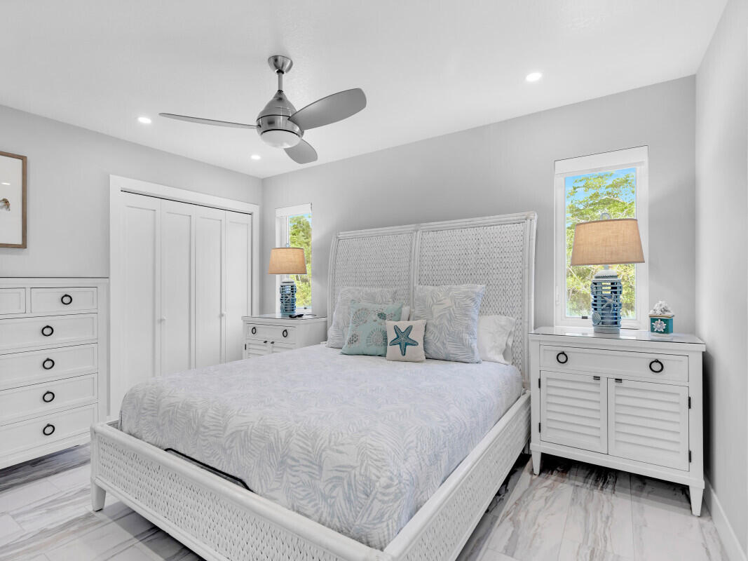 325 Calusa Street, Unit 359 Key Largo, FL 33037 - Photo 11 of 52 a bedroom with a large bed and a window