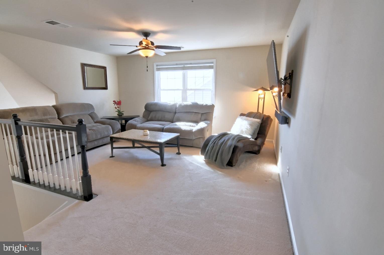 13170 Triple Crown Loop Gainesville, VA 20155 - Photo 46 of 71 a living room with furniture and a window