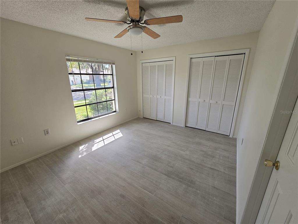 11127 Peppertree Lane Port Richey, FL 34668 - Photo 16 of 25 a view of an empty room with a window