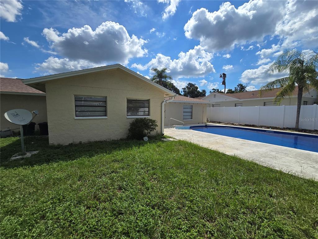 11127 Peppertree Lane Port Richey, FL 34668 - Photo 2 of 25 a view of a backyard of the house
