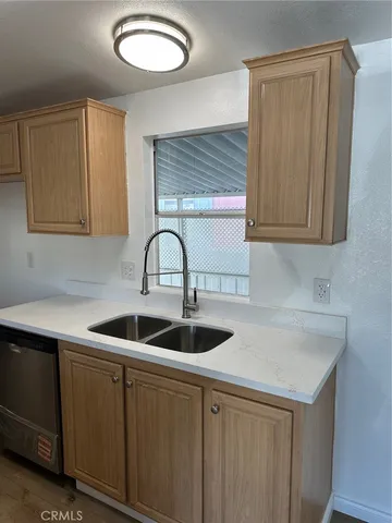 a kitchen with a sink and cabinets