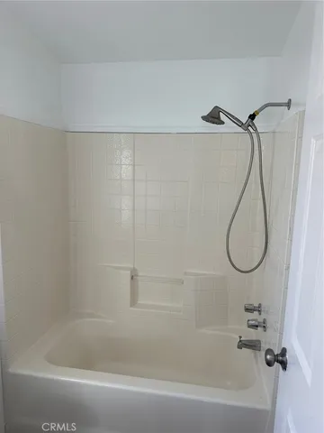 a bathroom with a bath tub and a shower
