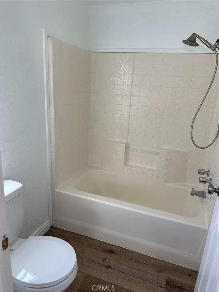 9861 Mission, Unit 14 Riverside, CA 92509 - Photo 22 of 23 a bathroom with a toilet and a bathtub