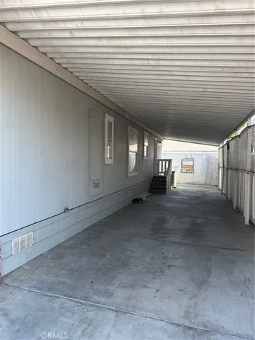 a view of empty room with white walls