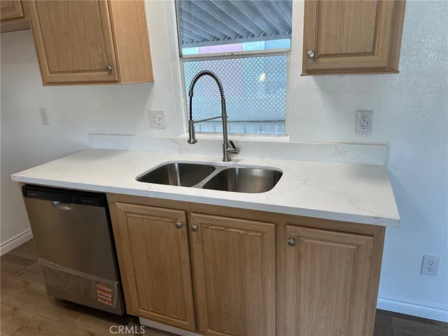 a kitchen with a sink and cabinets
