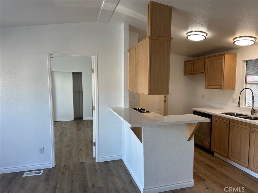 9861 Mission, Unit 14 Riverside, CA 92509 - Photo 7 of 23 a kitchen with sink stove and cabinets