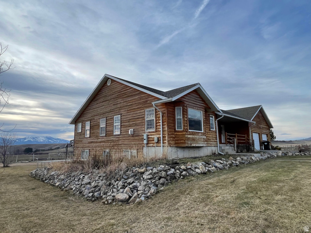 333 Lago Liberty Road Grace, ID 83241 - Photo 3 of 35 View of side of property featuring a mountain view and a shingled roof