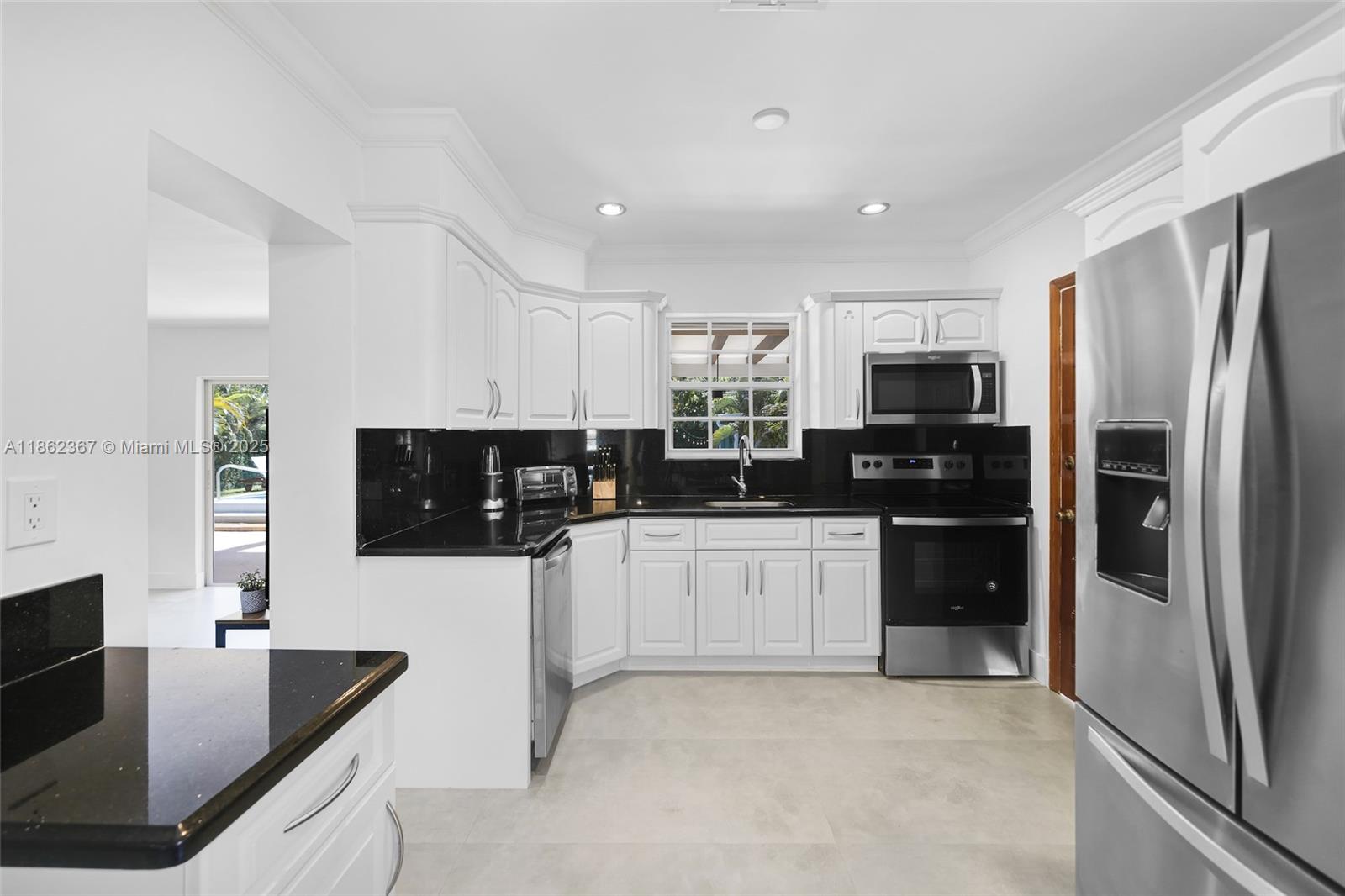 620 Southwest 22nd Road Miami, FL 33129 - Photo 13 of 31 a kitchen with stainless steel appliances a refrigerator sink and microwave