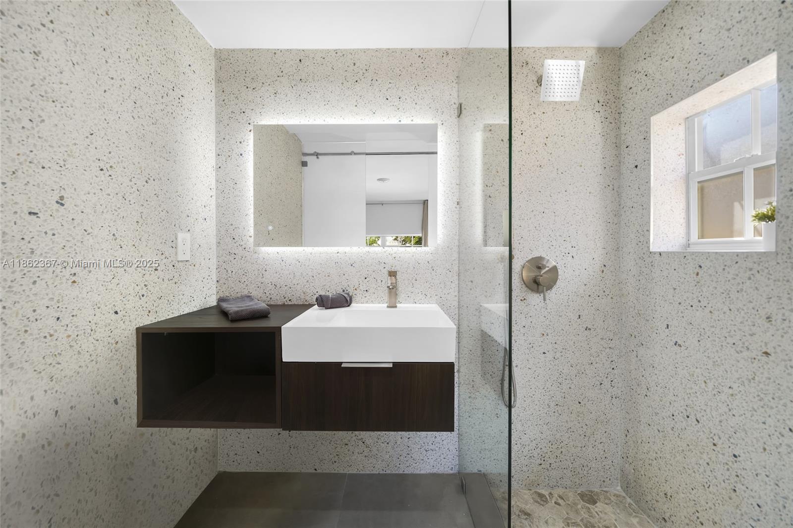 620 Southwest 22nd Road Miami, FL 33129 - Photo 20 of 31 a bathroom with a sink and a mirror