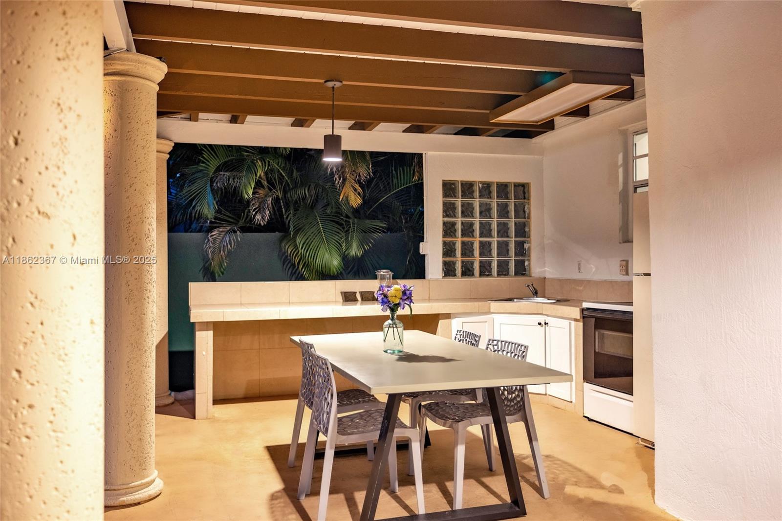 620 Southwest 22nd Road Miami, FL 33129 - Photo 26 of 31 a kitchen with a sink and chairs