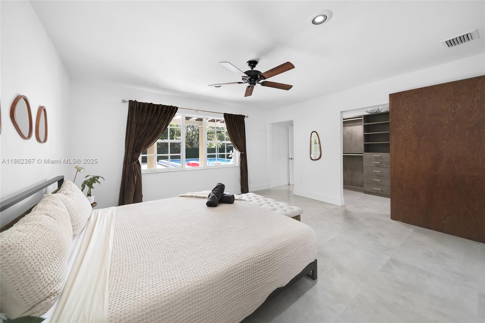 620 Southwest 22nd Road Miami, FL 33129 - Photo 7 of 31 a bedroom with a bed dresser and a window