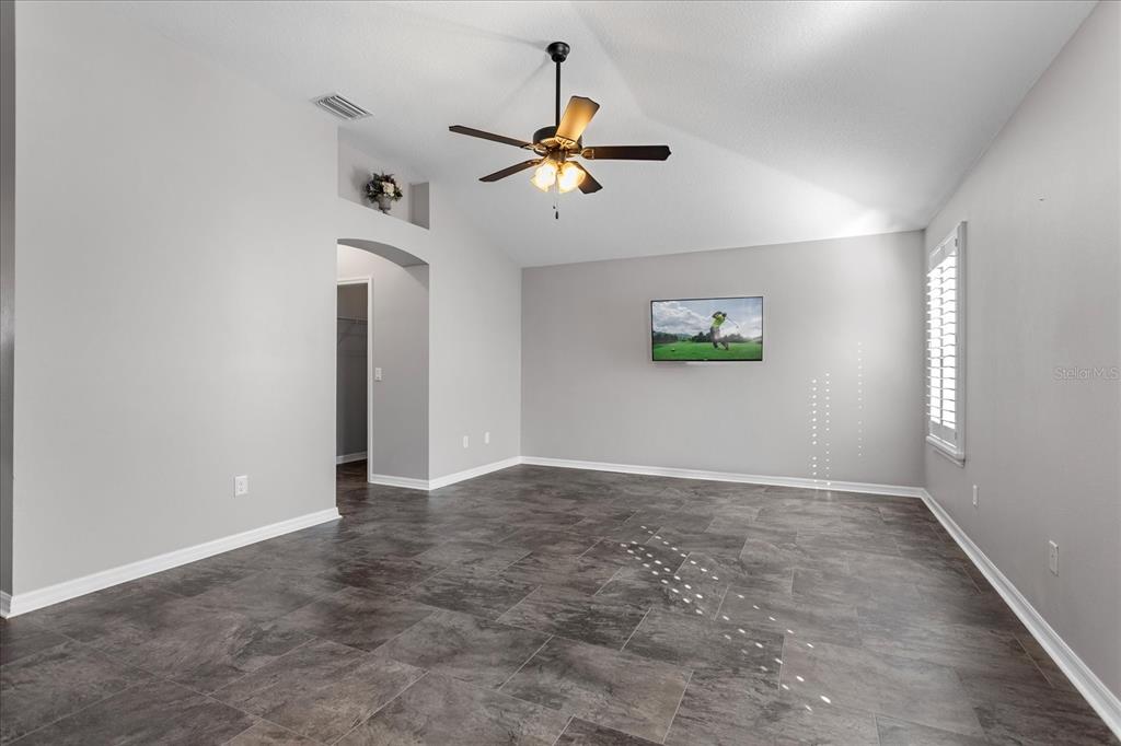 566 Allenwood Loop The Villages, FL 32162 - Photo 17 of 32 wooden floor in an empty room