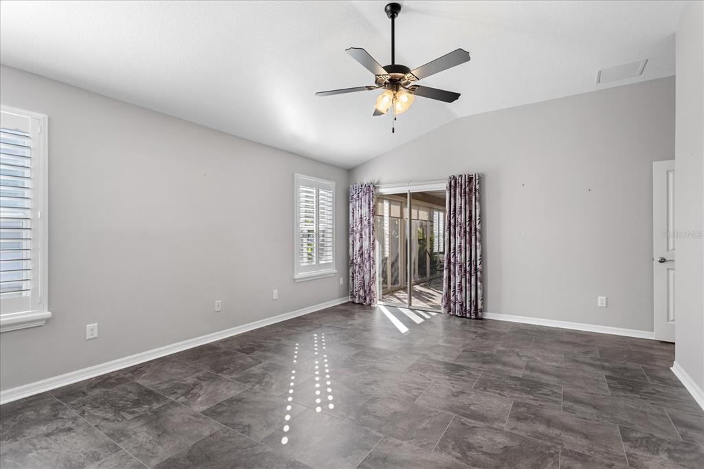 566 Allenwood Loop The Villages, FL 32162 - Photo 18 of 32 a view of an empty room with a window