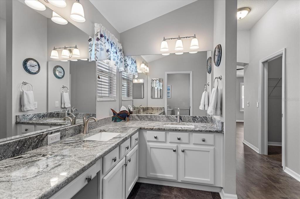 566 Allenwood Loop The Villages, FL 32162 - Photo 20 of 32 a bathroom with a sink double vanity and a mirror