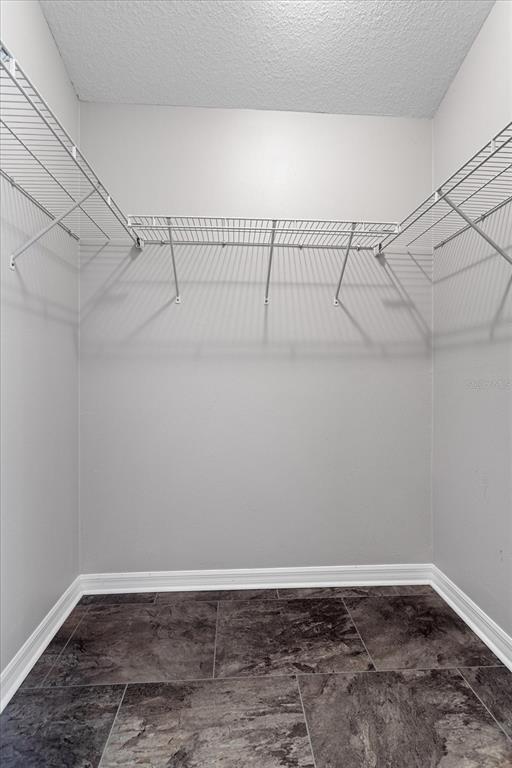 566 Allenwood Loop The Villages, FL 32162 - Photo 22 of 32 a view of a room with racks on the wall