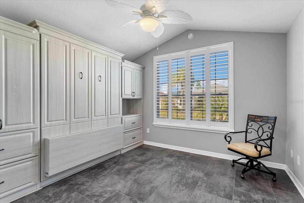 566 Allenwood Loop The Villages, FL 32162 - Photo 23 of 32 a view of a workspace with furniture and a window