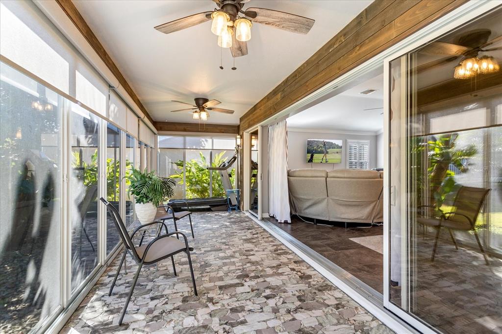 566 Allenwood Loop The Villages, FL 32162 - Photo 29 of 32 a living room with patio furniture