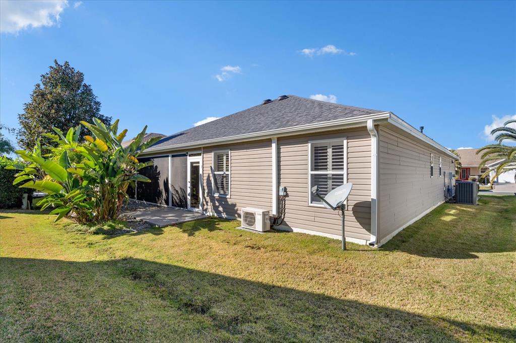566 Allenwood Loop The Villages, FL 32162 - Photo 32 of 32 a front view of a house with a yard