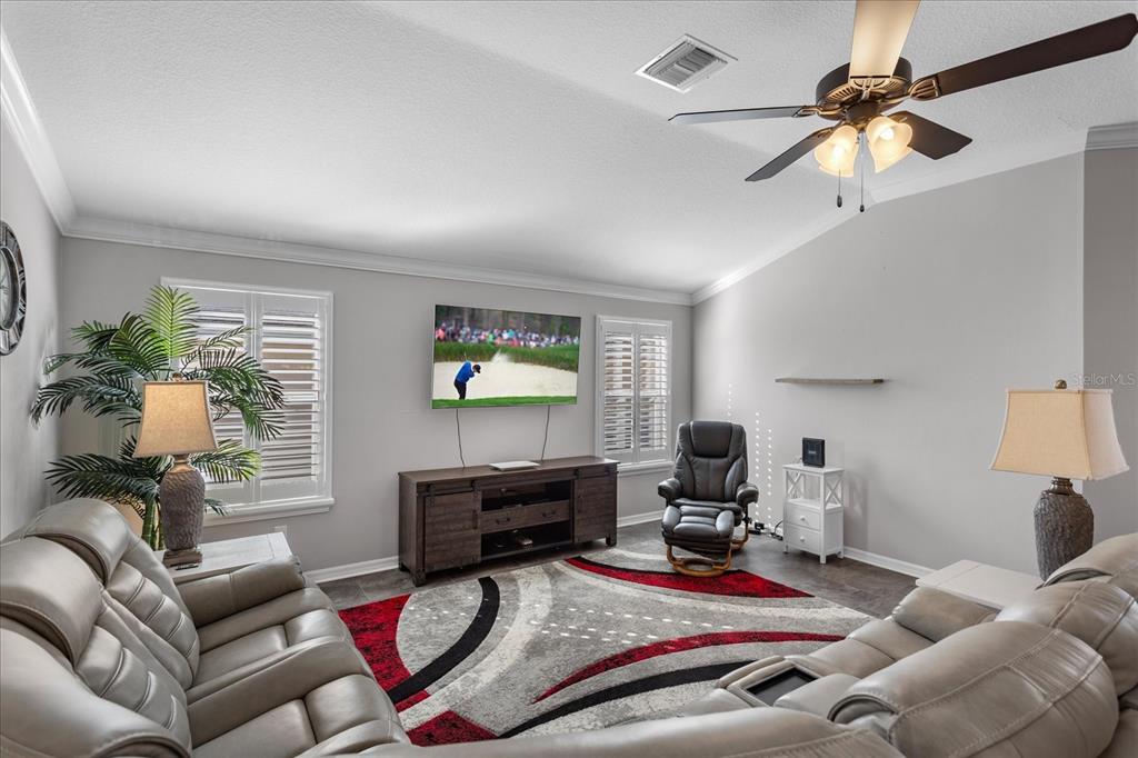 566 Allenwood Loop The Villages, FL 32162 - Photo 7 of 32 a living room with furniture