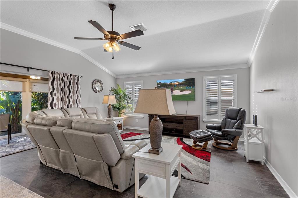 566 Allenwood Loop The Villages, FL 32162 - Photo 8 of 32 a living room with furniture and a window