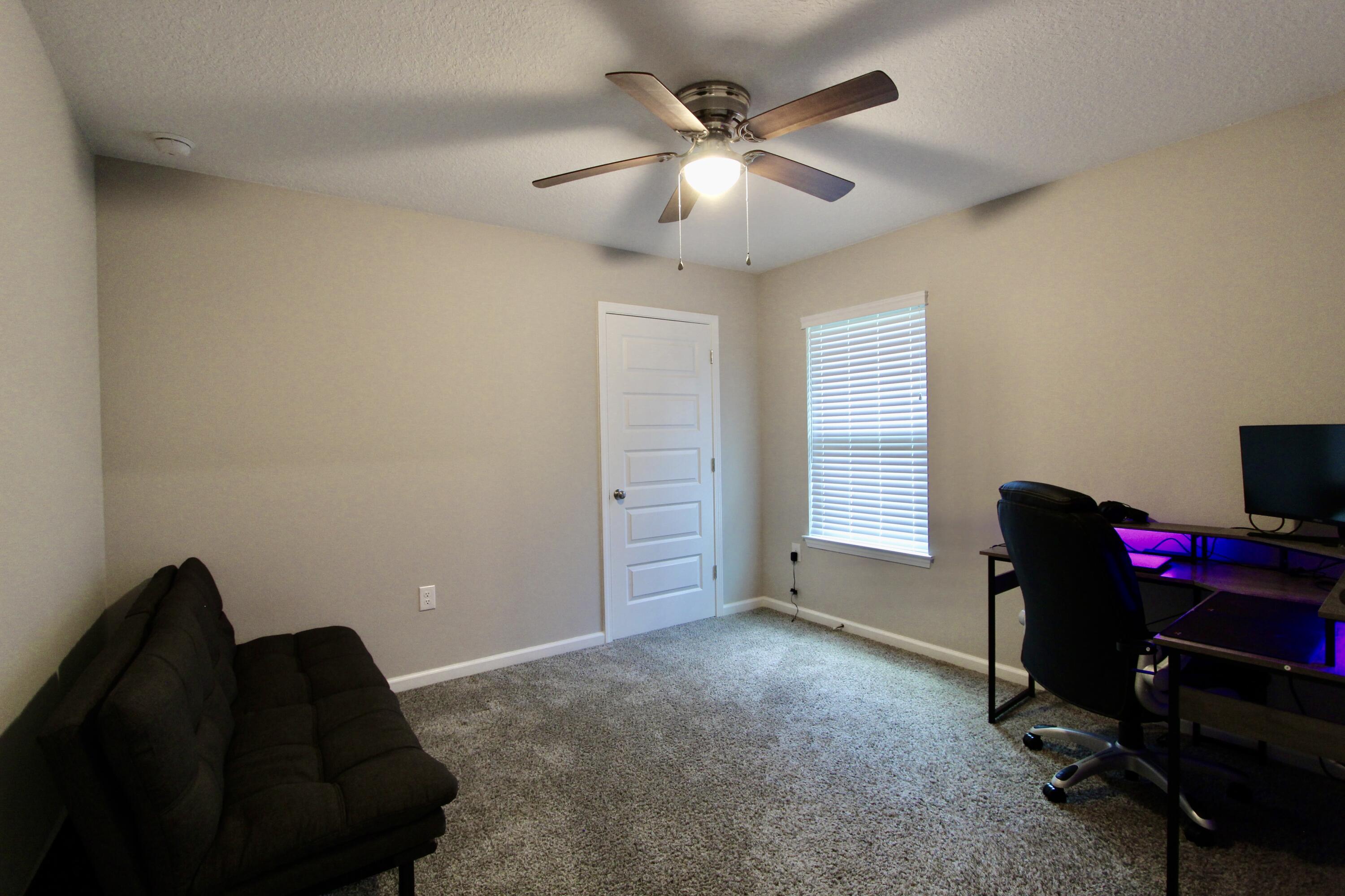 102 Windsor Drive Crestview, FL 32539 - Photo 17 of 26 a view of a workspace with furniture and a window