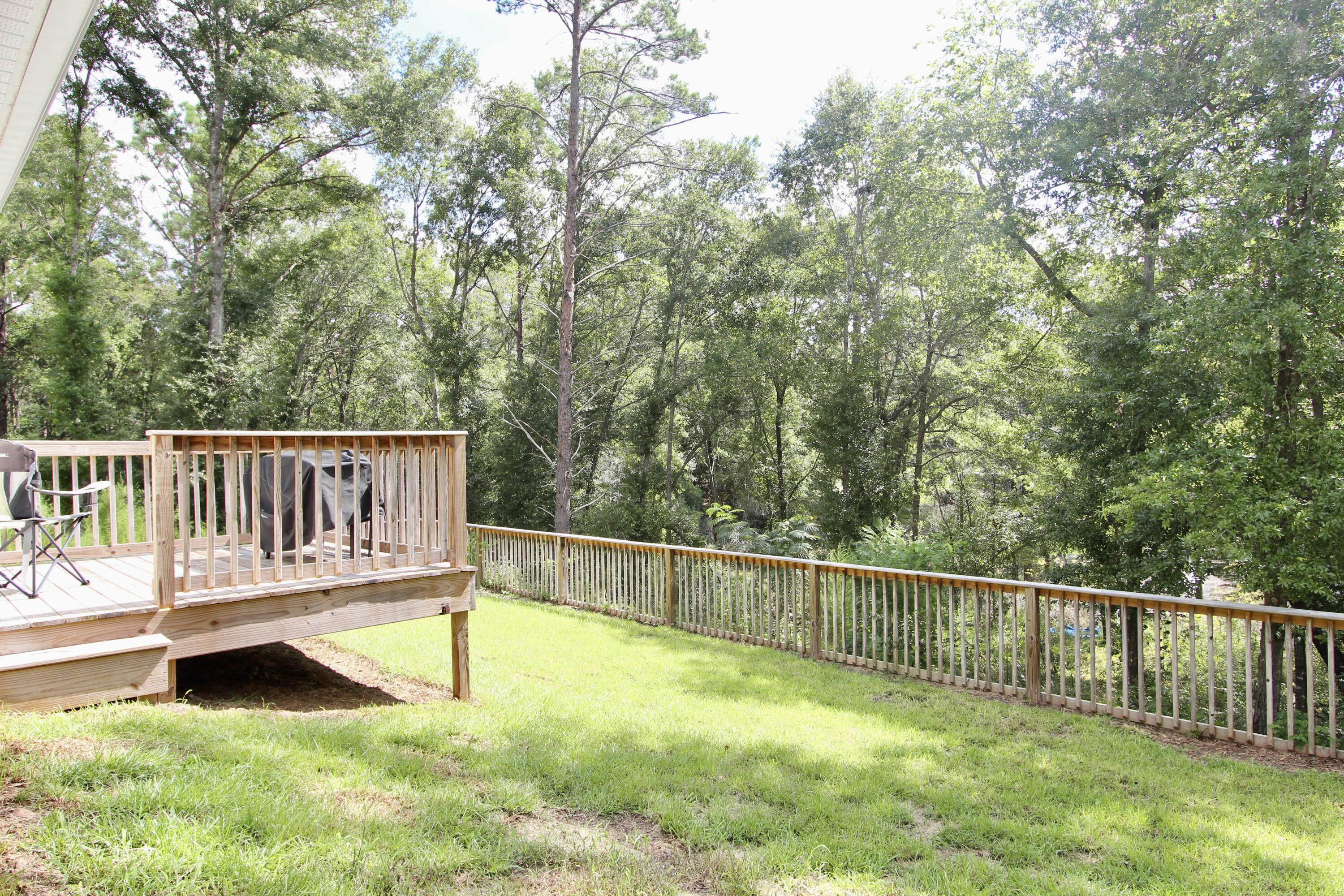 102 Windsor Drive Crestview, FL 32539 - Photo 24 of 26 a view of an outdoor space with a lake view