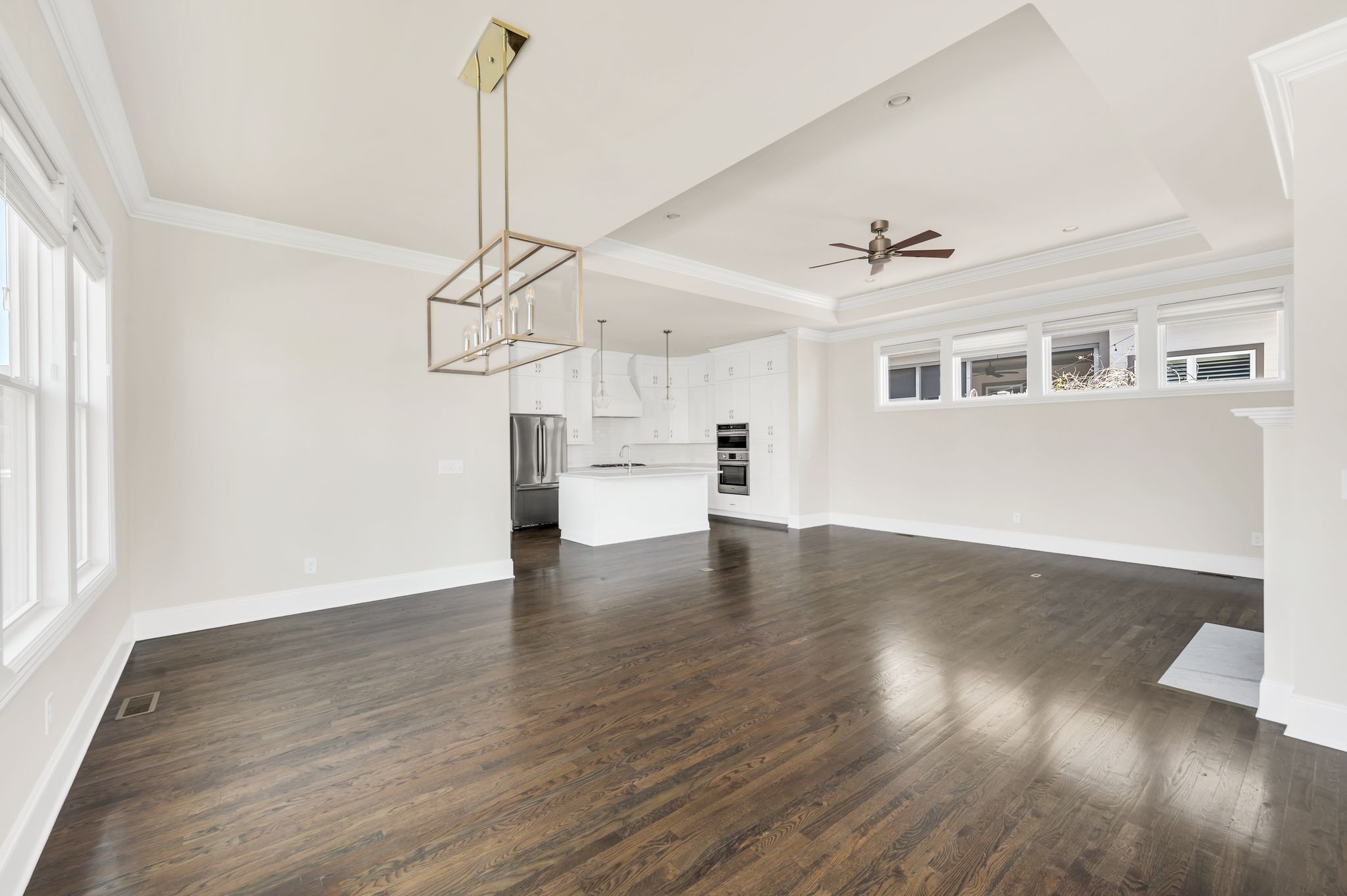 2000 Erwin Street Franklin, TN 37064 - Photo 13 of 97 a view of a room with wooden floor windows and a chandelier