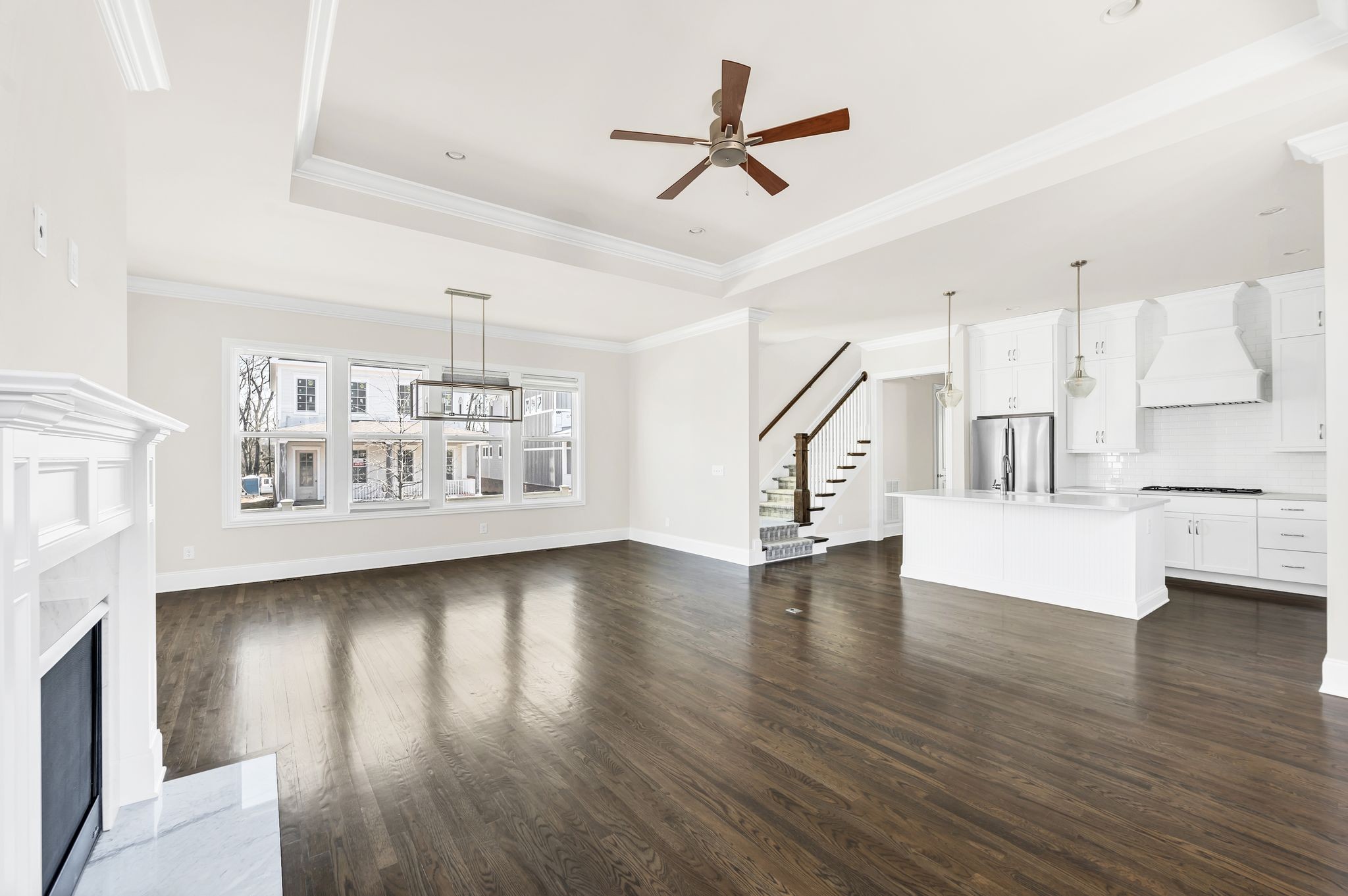 2000 Erwin Street Franklin, TN 37064 - Photo 15 of 97 a view of an empty room with wooden floor and a ceiling fan